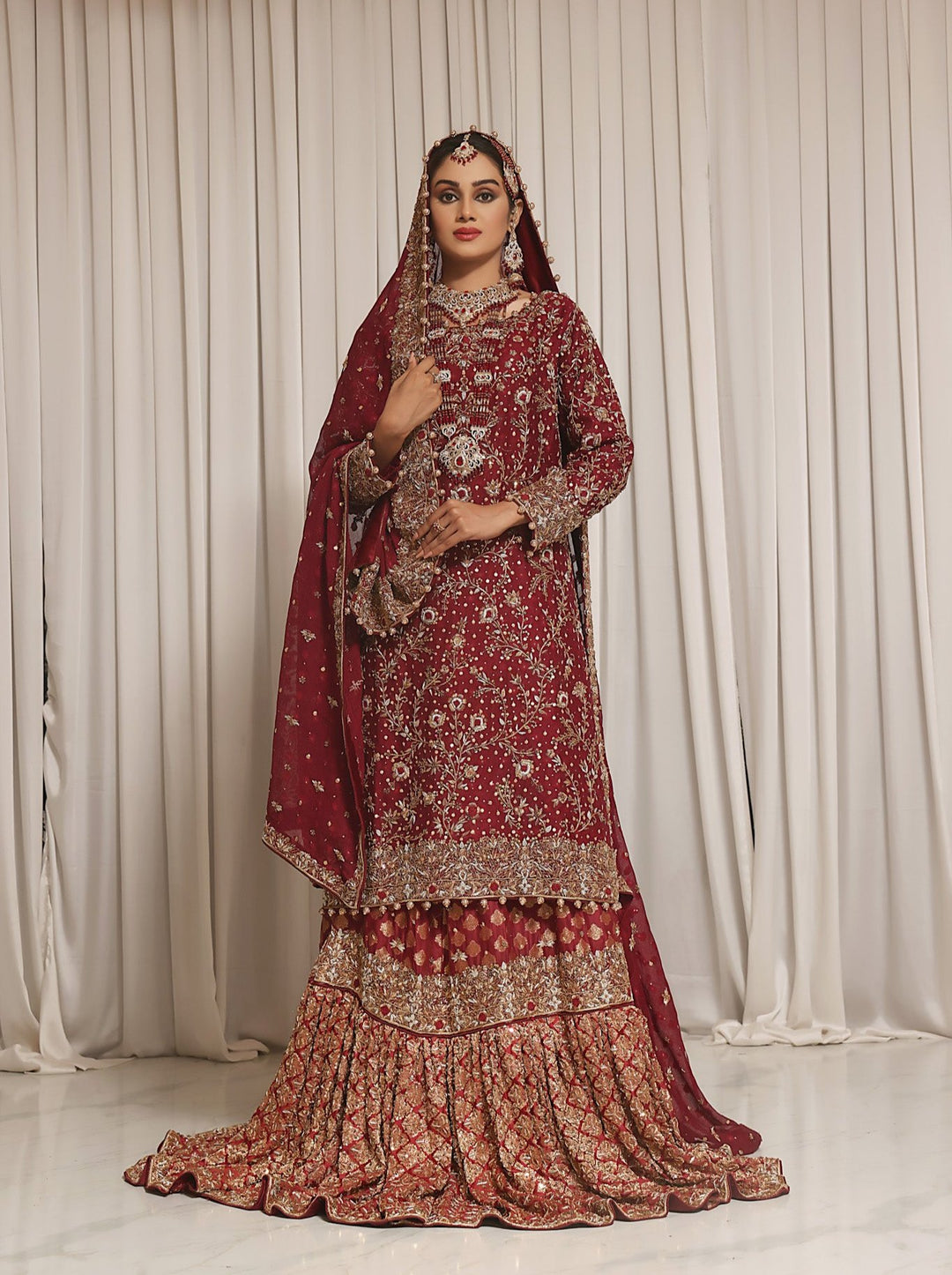 Shirin- Deep red Pakistani bridal lehengas in Toronto Karigur Shirin- Deep red Pakistani bridal lehengas in Toronto Karigur